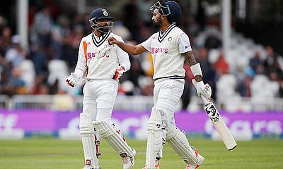India's KL Rahul and Ravindra Jadeja walk off the pitch for the break