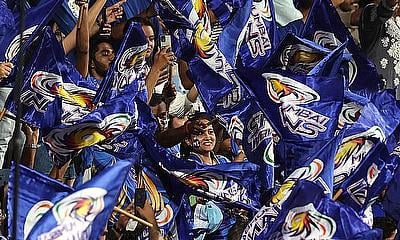 Mumbai Indian'' fans wave flags during a match